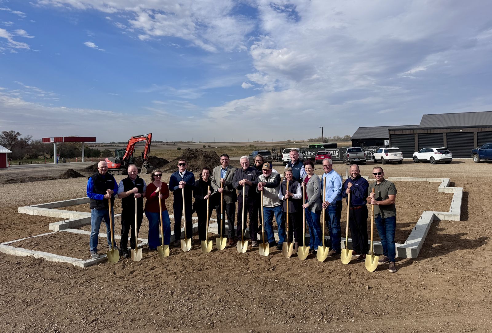 BankStar leadership poses with golden shovels during a groundbreaking ceremony at the future Lake Norden site.